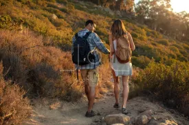 Couple of hikers walking down the hill